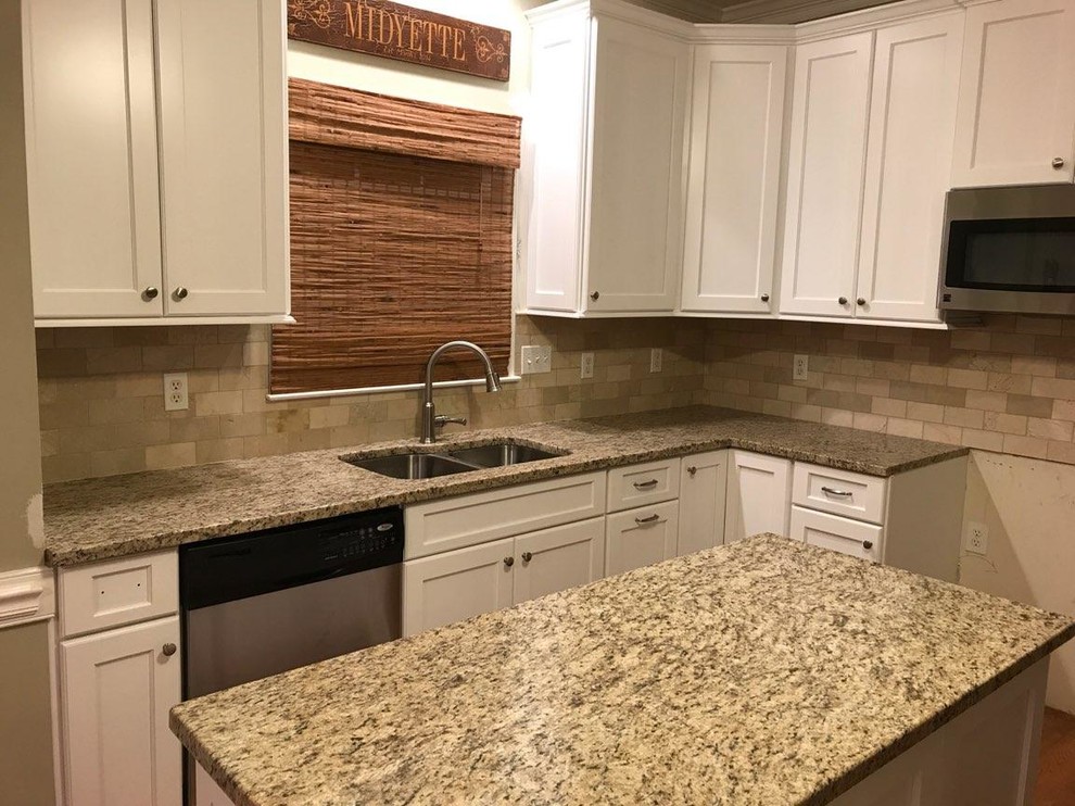 Example of a mid-sized trendy l-shaped medium tone wood floor and brown floor kitchen pantry design in Raleigh with an undermount sink, shaker cabinets, white cabinets, granite countertops, beige backsplash, porcelain backsplash, stainless steel appliances and an island