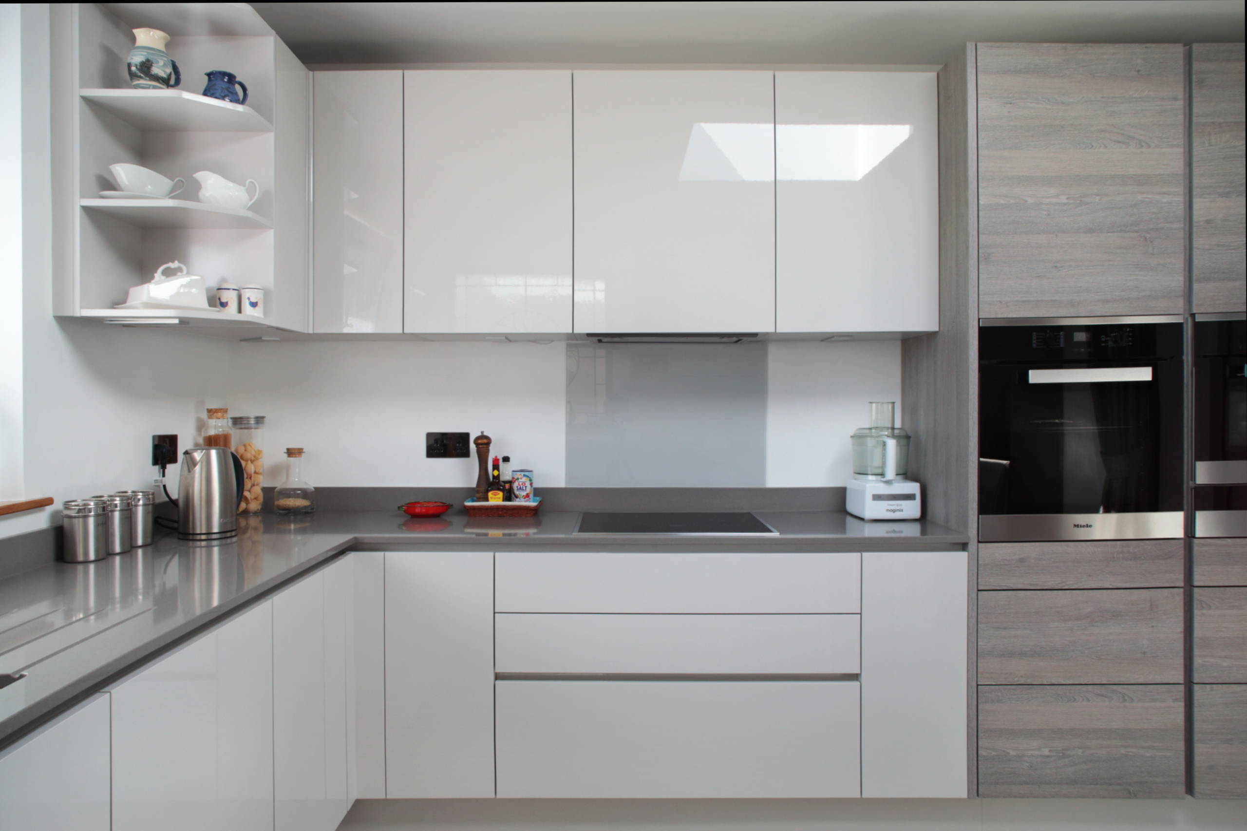 light grey high gloss kitchen with silestone worktop