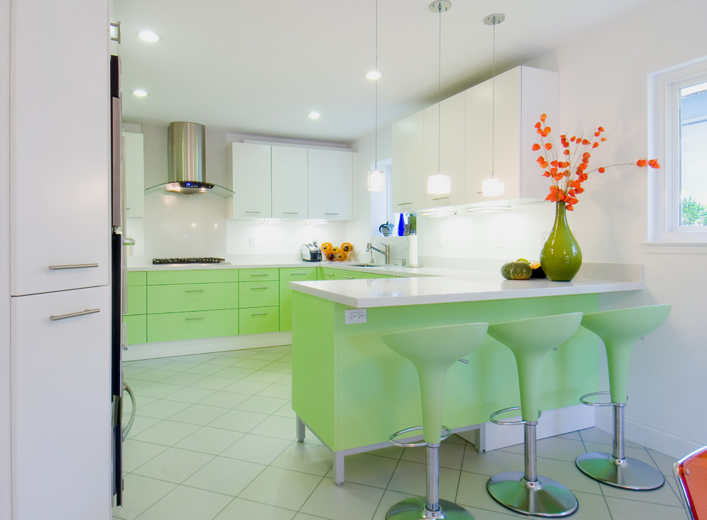 Inspiration for a mid-sized contemporary u-shaped ceramic tile and white floor eat-in kitchen remodel in San Francisco with an undermount sink, flat-panel cabinets, green cabinets, quartz countertops, white backsplash, stone slab backsplash, paneled appliances and a peninsula