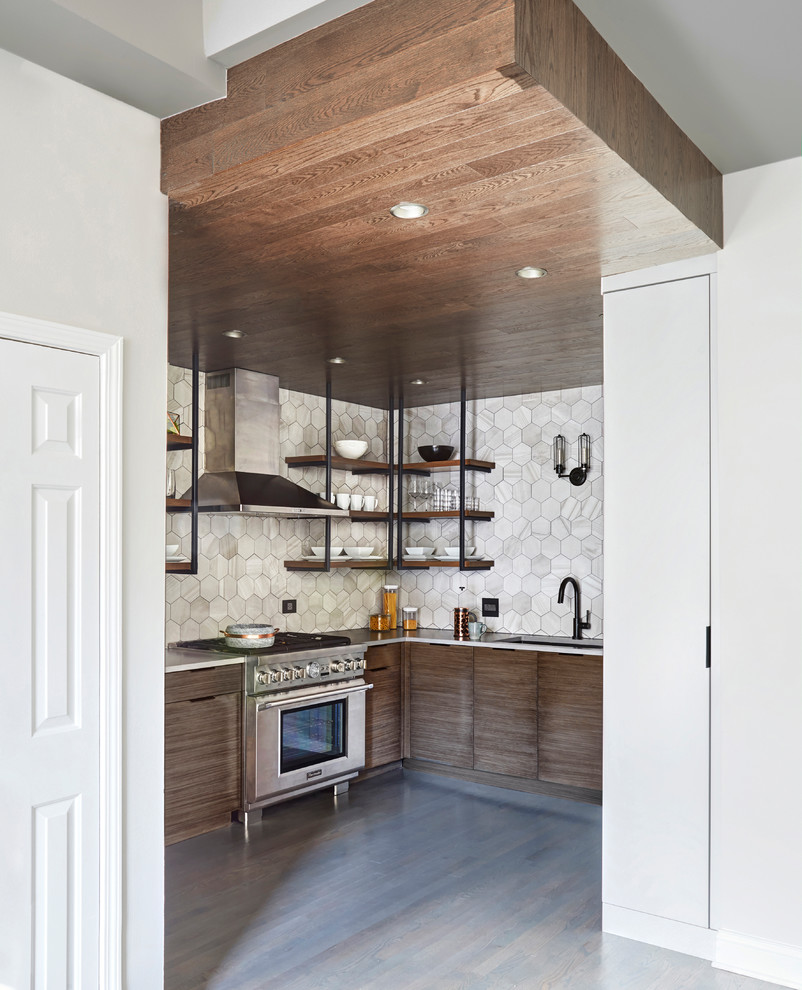 Inspiration for a mid-sized industrial u-shaped medium tone wood floor and gray floor kitchen pantry remodel in Chicago with an undermount sink, flat-panel cabinets, gray cabinets, quartz countertops, gray backsplash, porcelain backsplash, stainless steel appliances and no island