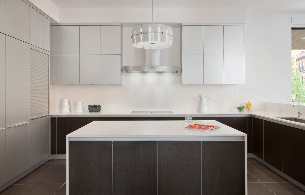 This is an example of a contemporary l-shaped kitchen in Chicago with a double-bowl sink, flat-panel cabinets, white cabinets and stainless steel appliances.