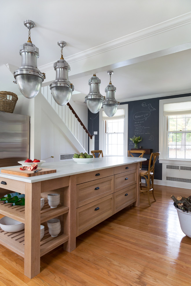 Inspiration for a large transitional medium tone wood floor kitchen remodel in Bridgeport with a farmhouse sink, shaker cabinets, medium tone wood cabinets, marble countertops, white backsplash, subway tile backsplash and an island