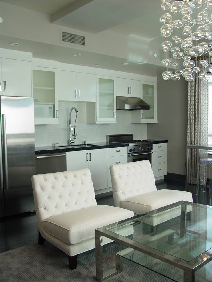 Open concept kitchen - contemporary single-wall open concept kitchen idea in San Francisco with a single-bowl sink, flat-panel cabinets, white cabinets and stainless steel appliances