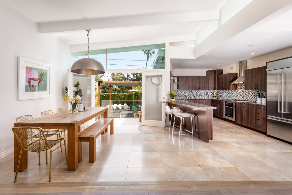 Example of a mid-sized mid-century modern u-shaped marble floor, beige floor and exposed beam eat-in kitchen design in Los Angeles with an undermount sink, flat-panel cabinets, dark wood cabinets, terrazzo countertops, multicolored backsplash, glass sheet backsplash, stainless steel appliances, a peninsula and brown countertops