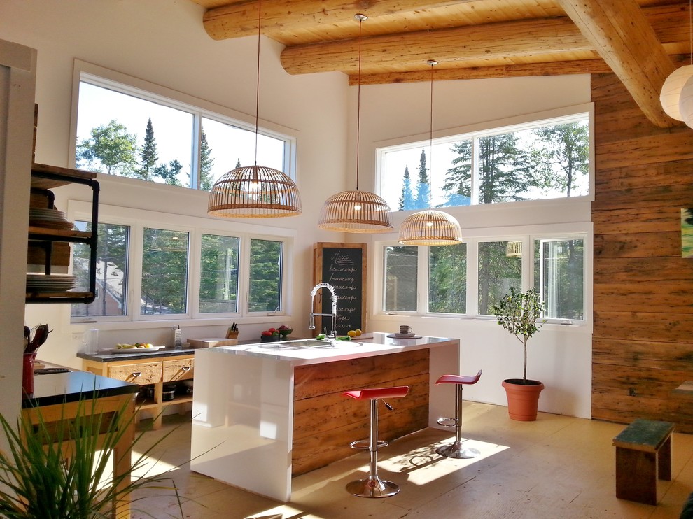 Example of a farmhouse l-shaped plywood floor kitchen design in Montreal with an island