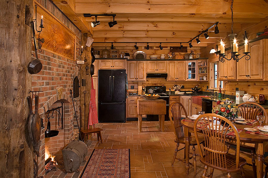 Mountain style l-shaped eat-in kitchen photo in Burlington with a farmhouse sink, raised-panel cabinets, medium tone wood cabinets and black appliances