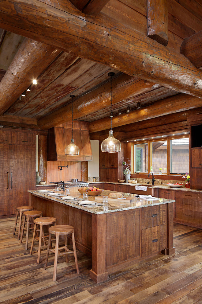 Inspiration för ett mycket stort rustikt l-kök, med skåp i mellenmörkt trä, granitbänkskiva, mellanmörkt trägolv, en köksö, en rustik diskho, fönster som stänkskydd och integrerade vitvaror