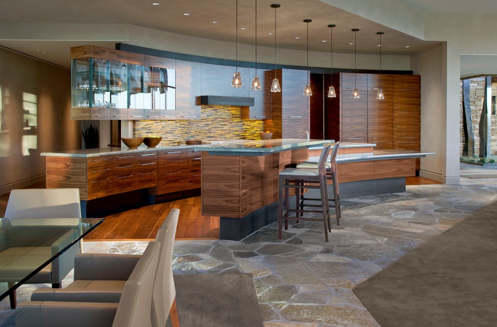 Trendy eat-in kitchen photo in Phoenix with flat-panel cabinets, dark wood cabinets, multicolored backsplash, matchstick tile backsplash and an island