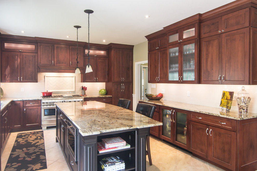 Example of a huge classic u-shaped ceramic tile and beige floor eat-in kitchen design in Philadelphia with an undermount sink, raised-panel cabinets, dark wood cabinets, granite countertops, white backsplash, ceramic backsplash, stainless steel appliances, an island and beige countertops