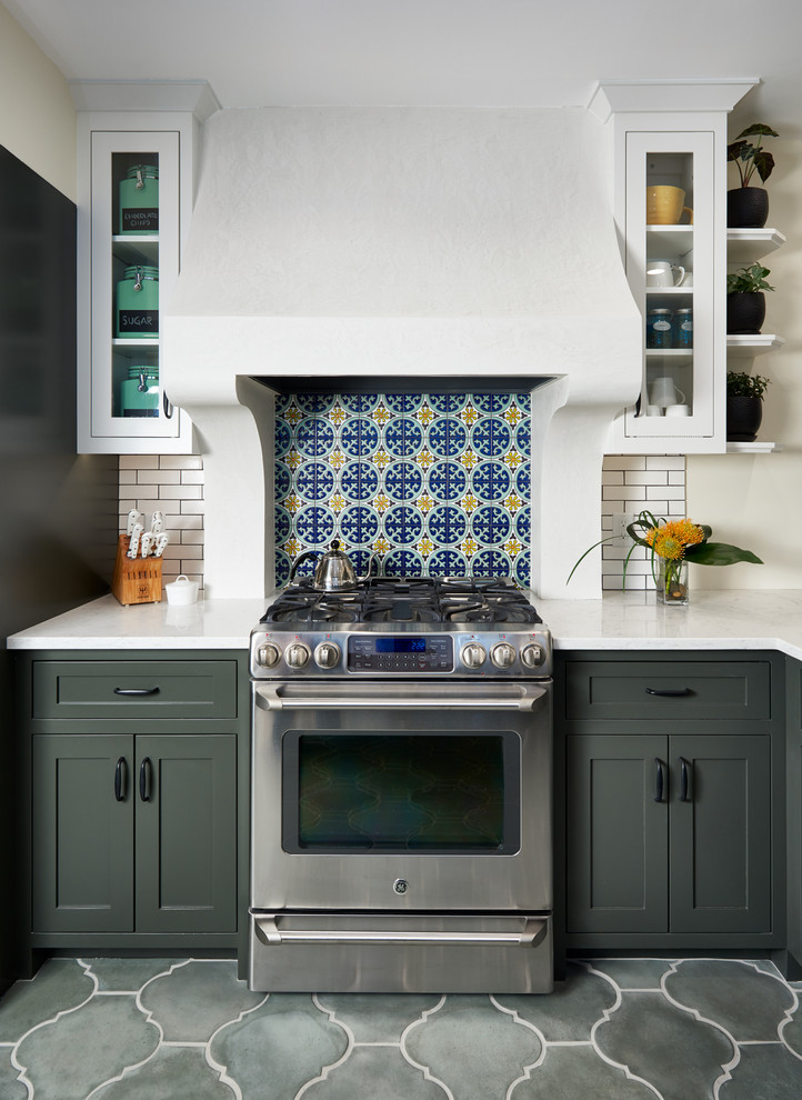 Inspiration for a mid-sized mediterranean gray floor kitchen remodel in Minneapolis with shaker cabinets, quartz countertops, multicolored backsplash, stainless steel appliances and gray cabinets
