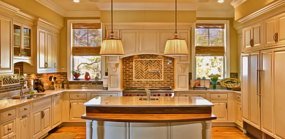 Elegant u-shaped kitchen photo in Charleston with brown backsplash and subway tile backsplash