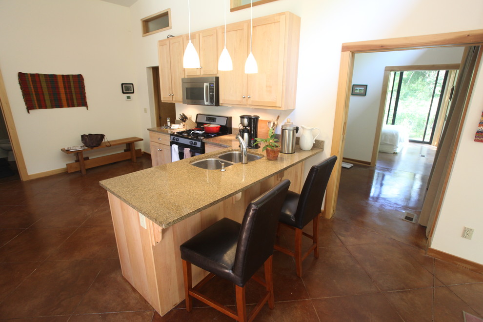 Example of a small mountain style l-shaped ceramic tile and brown floor eat-in kitchen design in Indianapolis with a double-bowl sink, shaker cabinets, light wood cabinets, quartz countertops and a peninsula
