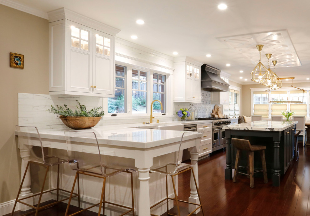 Example of a large transitional l-shaped bamboo floor and brown floor eat-in kitchen design in San Francisco with a farmhouse sink, shaker cabinets, gray cabinets, marble countertops, white backsplash, marble backsplash, stainless steel appliances and two islands