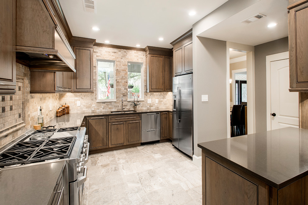 Mid-sized elegant l-shaped travertine floor and beige floor kitchen pantry photo in Dallas with beaded inset cabinets, dark wood cabinets, quartz countertops, beige backsplash, mosaic tile backsplash, stainless steel appliances, a peninsula and an undermount sink