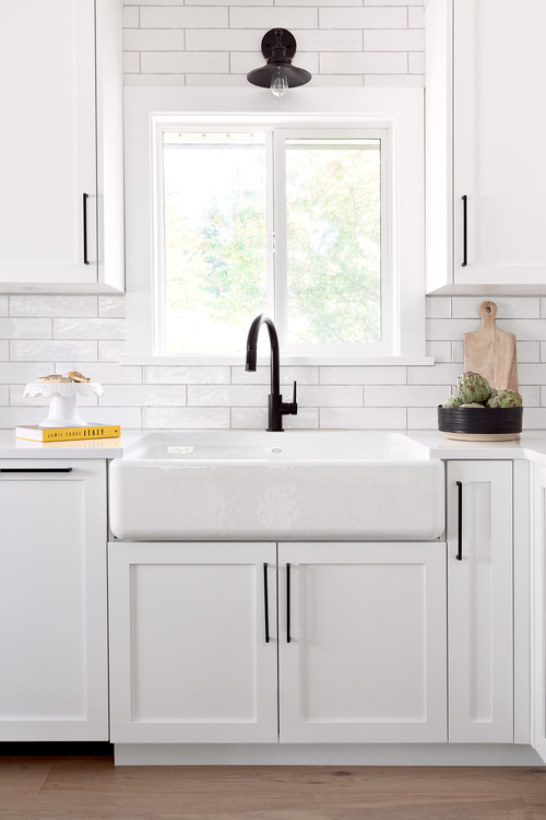 Timeless All-White: Modern Farmhouse Kitchen Inspirations with Black Hardware and Farmhouse Sink