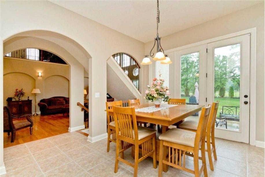 Large elegant light wood floor kitchen/dining room combo photo in Columbus