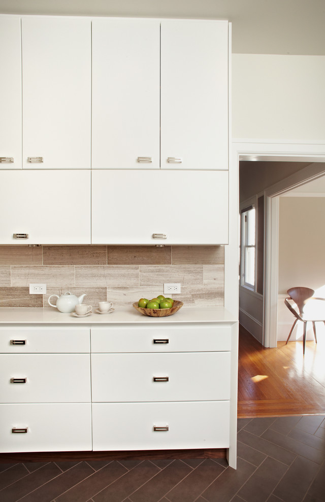 Enclosed kitchen - contemporary enclosed kitchen idea in San Francisco with flat-panel cabinets, white cabinets, quartz countertops, gray backsplash and stone tile backsplash
