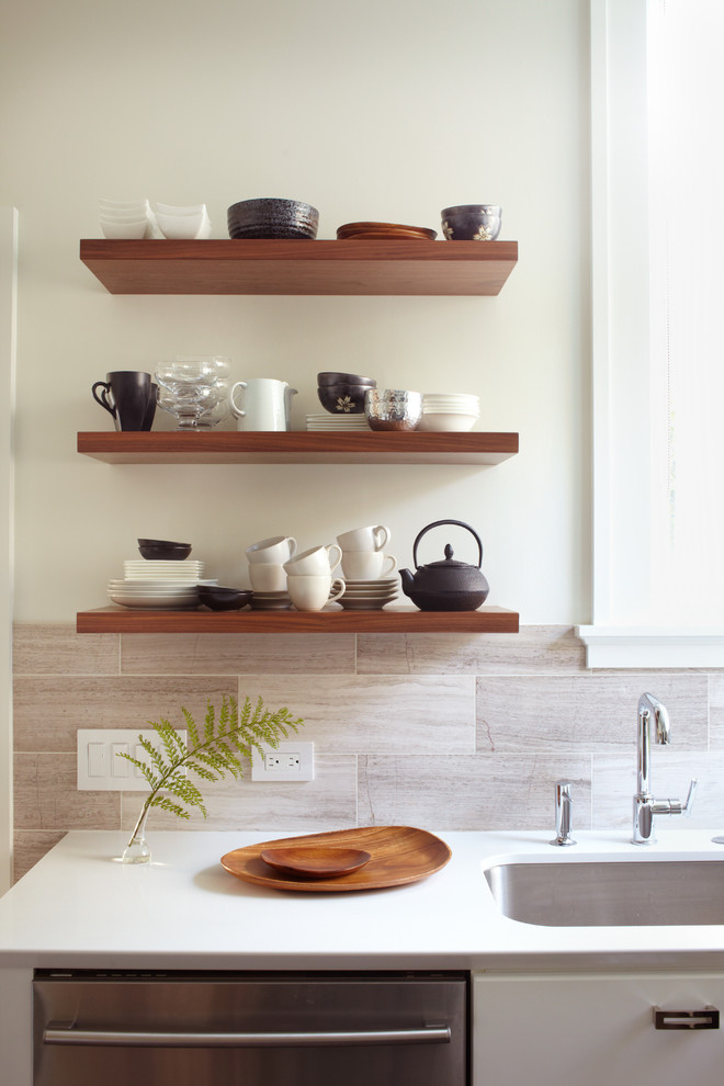 Example of a trendy kitchen design in San Francisco with open cabinets, quartz countertops and an undermount sink