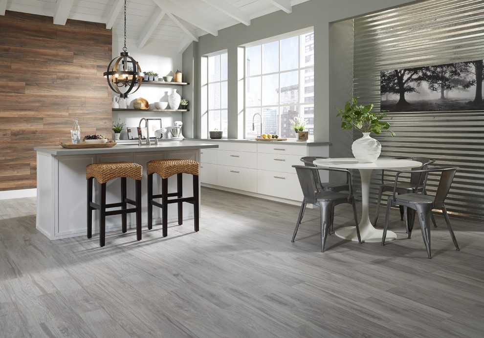 Eat-in kitchen - large contemporary dark wood floor and gray floor eat-in kitchen idea in Other with flat-panel cabinets, white cabinets, granite countertops and a peninsula