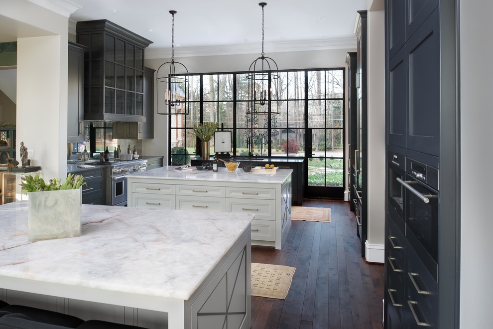 This is an example of a classic kitchen in Atlanta with quartz worktops and multiple islands.