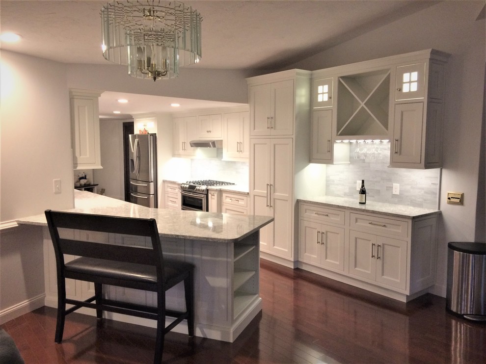 Design ideas for a large classic galley open plan kitchen in Boston with a belfast sink, beaded cabinets, white cabinets, engineered stone countertops, grey splashback, stone tiled splashback, stainless steel appliances, dark hardwood flooring, a breakfast bar and red floors.