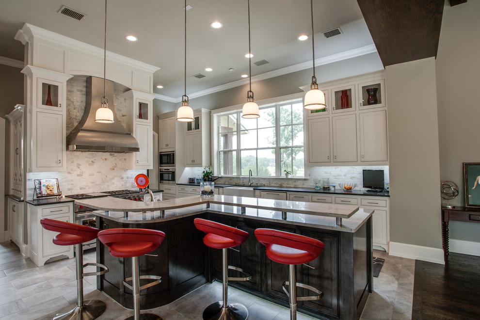 Eat-in kitchen - mid-sized transitional l-shaped ceramic tile eat-in kitchen idea in Dallas with a drop-in sink, raised-panel cabinets, white cabinets, solid surface countertops, white backsplash, subway tile backsplash, stainless steel appliances and an island
