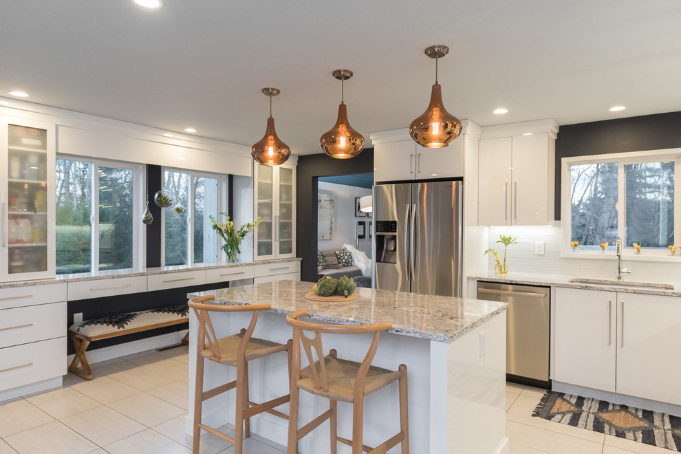 Example of a mid-sized danish l-shaped plywood floor eat-in kitchen design in Manchester with an undermount sink, flat-panel cabinets, white cabinets, quartz countertops, multicolored backsplash, glass sheet backsplash, stainless steel appliances and an island