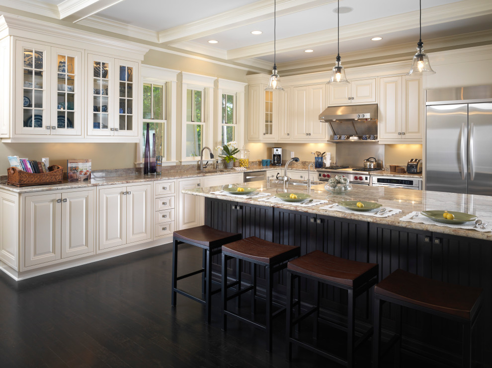 Large traditional l-shaped kitchen/diner in Tampa with a built-in sink, raised-panel cabinets, white cabinets, granite worktops, brown splashback, granite splashback, stainless steel appliances, dark hardwood flooring, an island, brown floors, brown worktops and a coffered ceiling.