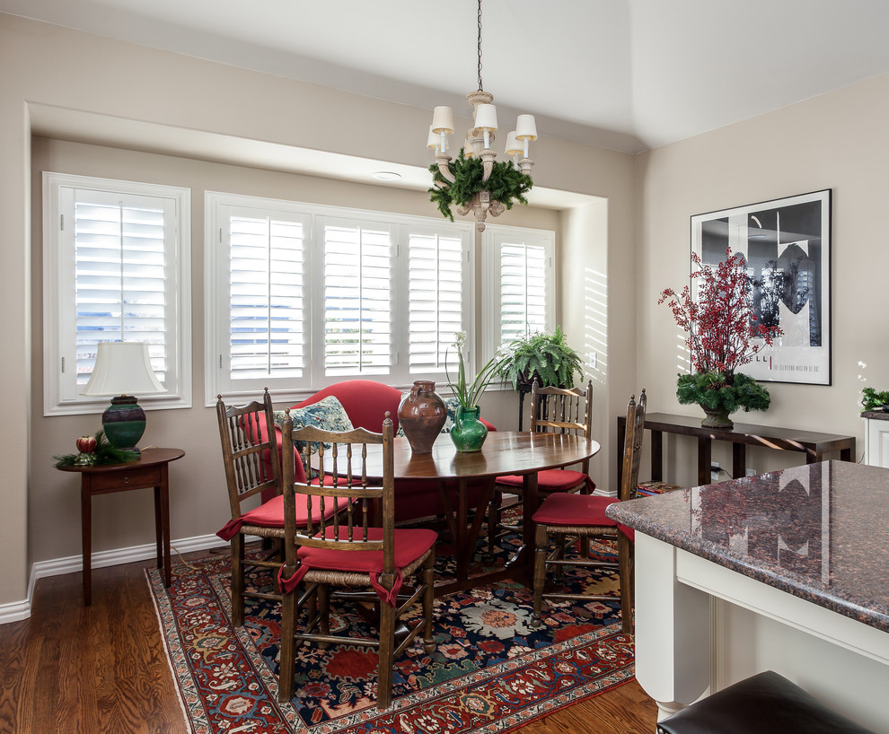 Example of a large classic dark wood floor dining room design in Denver