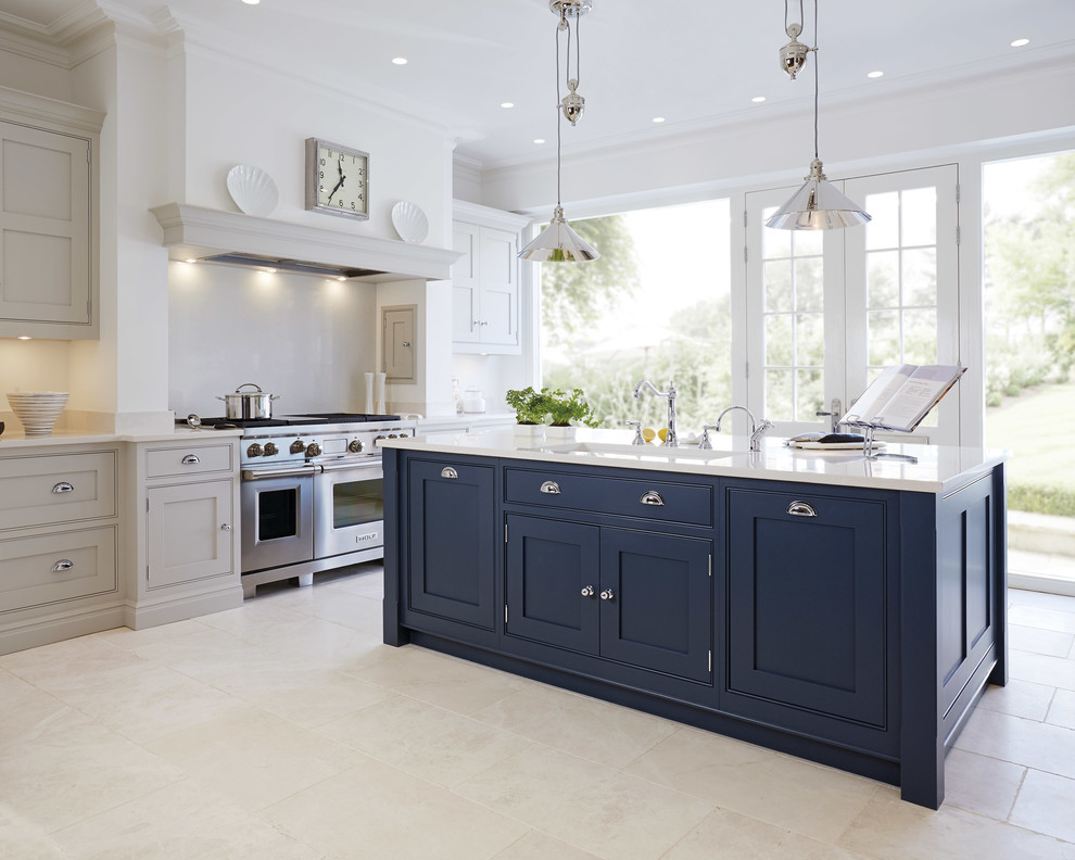 Large marble floor enclosed kitchen photo in Manchester with an undermount sink, shaker cabinets, blue cabinets, stainless steel appliances and an island