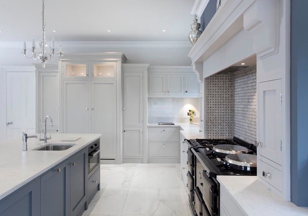 This is an example of a large classic u-shaped kitchen/diner in Other with a belfast sink, shaker cabinets, grey cabinets, quartz worktops, multi-coloured splashback, mosaic tiled splashback, stainless steel appliances, porcelain flooring and an island.