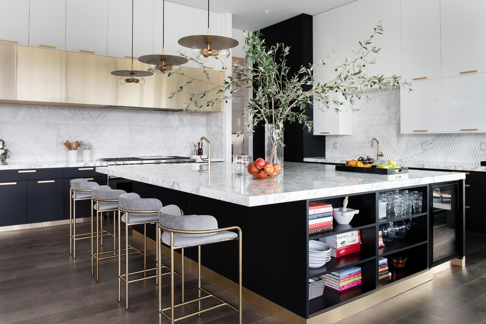 Large trendy dark wood floor and brown floor kitchen photo in Las Vegas with flat-panel cabinets, an island, marble countertops, white backsplash and white countertops