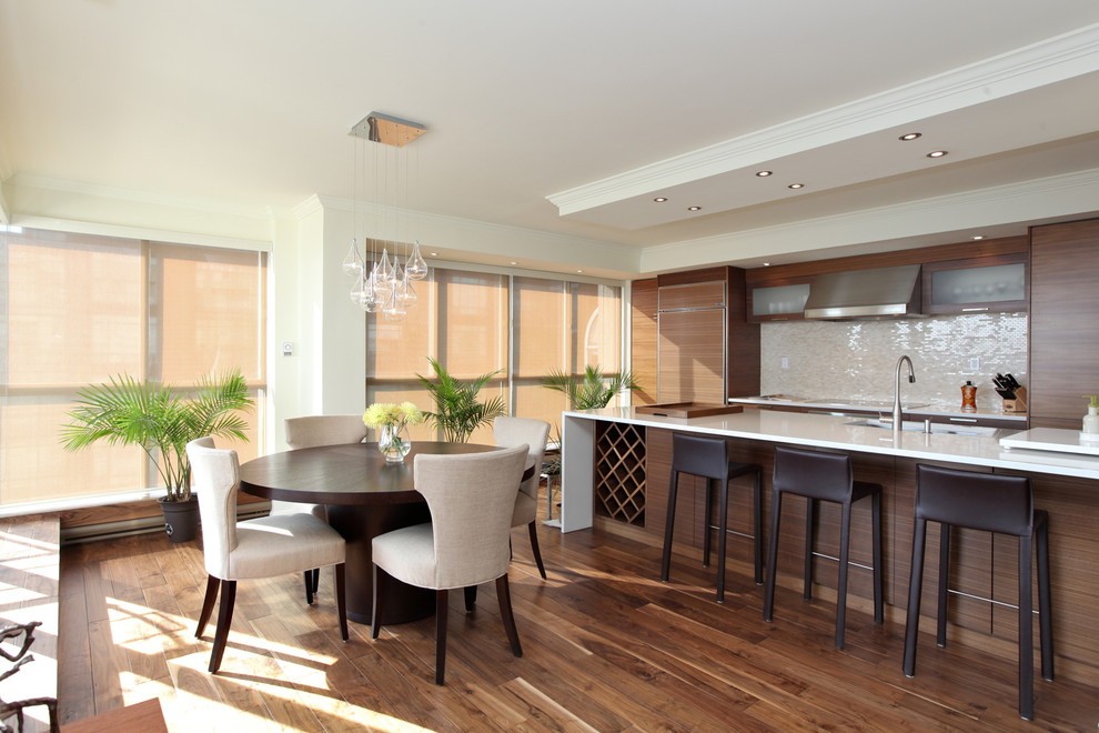 Design ideas for a contemporary galley kitchen/diner in Toronto with beige splashback and integrated appliances.