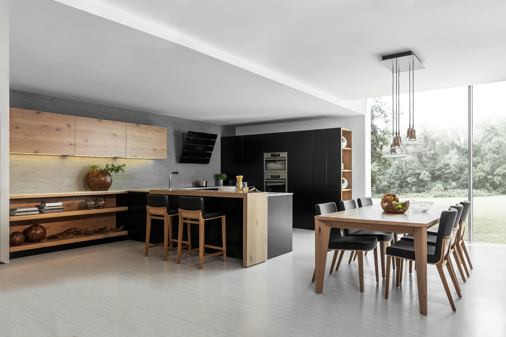 Inspiration for a medium sized modern u-shaped kitchen/diner in London with a single-bowl sink, flat-panel cabinets, dark wood cabinets, composite countertops, stainless steel appliances, ceramic flooring and an island.