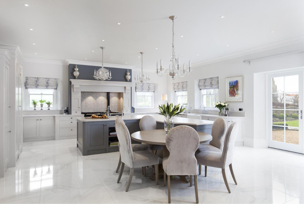 This is an example of a large classic u-shaped kitchen/diner in Other with a belfast sink, shaker cabinets, grey cabinets, quartz worktops, multi-coloured splashback, mosaic tiled splashback, stainless steel appliances, porcelain flooring and an island.