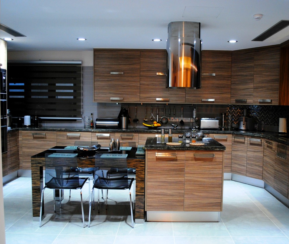 Photo of a contemporary kitchen in Other with flat-panel cabinets, medium wood cabinets and metallic splashback.