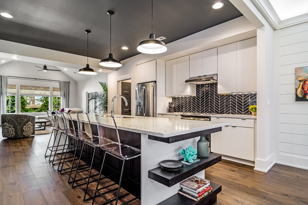 Open concept kitchen - large contemporary galley dark wood floor and brown floor open concept kitchen idea in Other with an undermount sink, flat-panel cabinets, black backsplash, stainless steel appliances, an island, marble countertops and ceramic backsplash