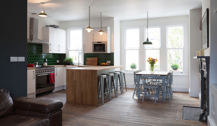 Example of a cottage chic kitchen design in London