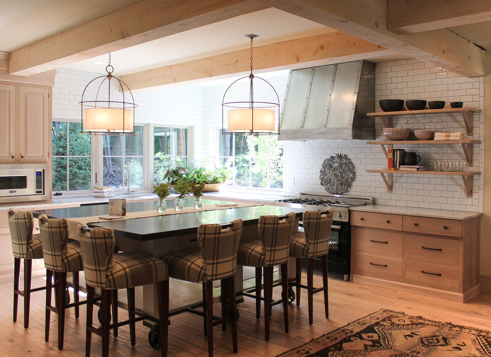 Inspiration for a contemporary kitchen remodel in Portland Maine with subway tile backsplash, flat-panel cabinets, light wood cabinets, white backsplash and stainless steel appliances