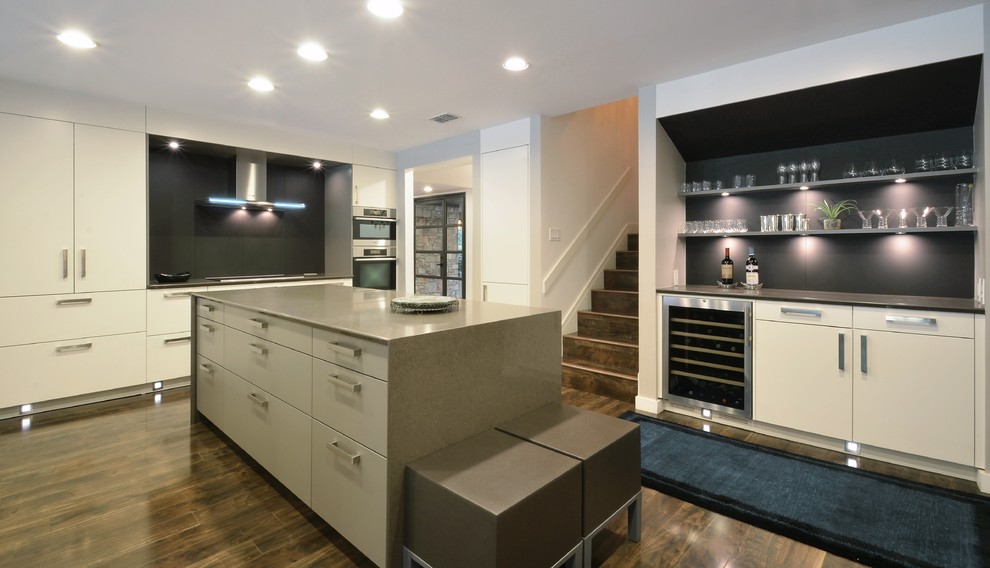 Design ideas for a contemporary kitchen in Austin with flat-panel cabinets, white cabinets, engineered stone countertops, stainless steel appliances, a submerged sink, brown splashback, glass sheet splashback and medium hardwood flooring.