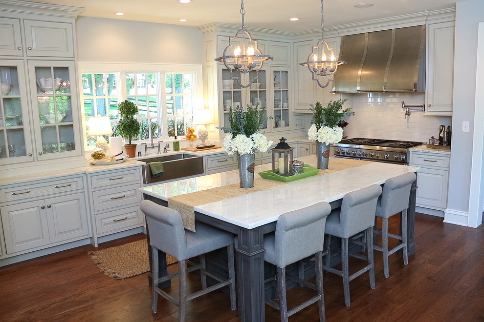 Example of a transitional kitchen design in Louisville with beaded inset cabinets, gray cabinets, marble countertops, gray backsplash, porcelain backsplash, stainless steel appliances and an island