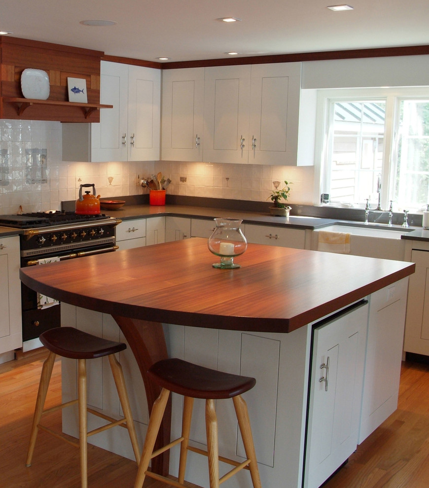 Design ideas for a classic l-shaped kitchen/diner in New York with wood worktops.