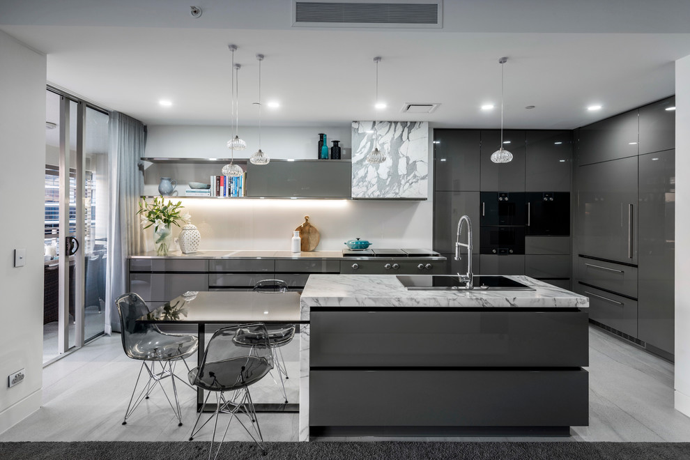 Photo of a contemporary u-shaped kitchen in Brisbane with flat-panel cabinets, grey cabinets, white splashback, black appliances and an island.