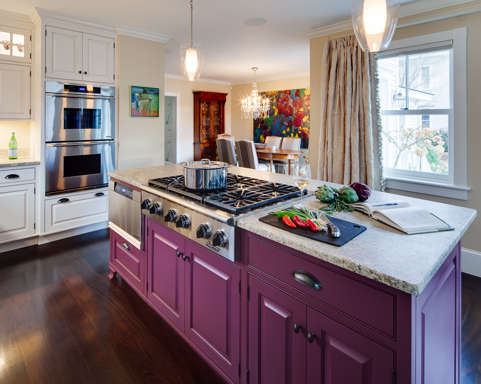 Inspiration for a large timeless l-shaped dark wood floor open concept kitchen remodel in Portland Maine with a farmhouse sink, raised-panel cabinets, white cabinets, laminate countertops, stainless steel appliances and an island