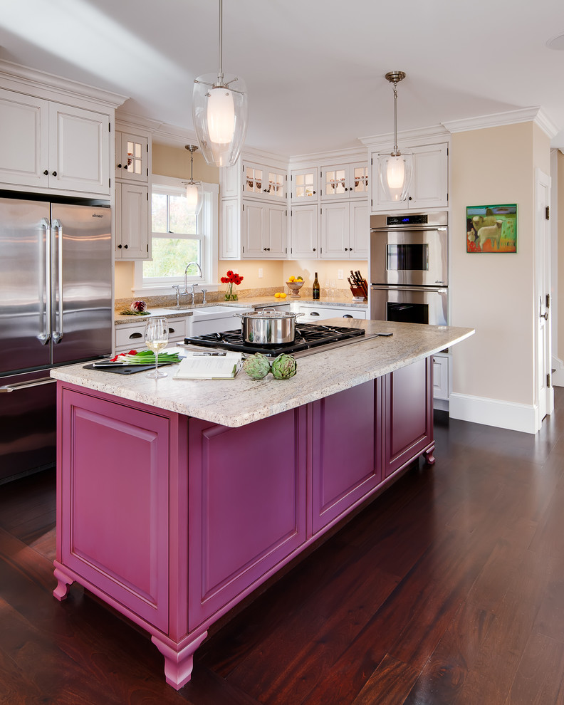Inspiration for a large classic l-shaped open plan kitchen in Portland Maine with a belfast sink, raised-panel cabinets, white cabinets, laminate countertops, stainless steel appliances, dark hardwood flooring and an island.