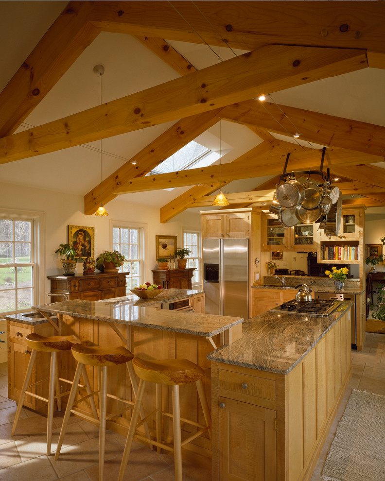 Inspiration for a timeless u-shaped enclosed kitchen remodel in Portland Maine with medium tone wood cabinets