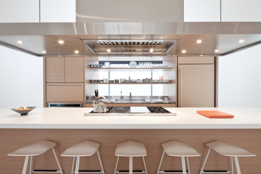 Photo of a scandinavian kitchen in Toronto with stainless steel worktops.