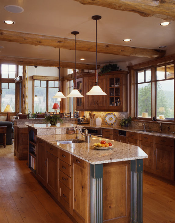 Large mountain style l-shaped light wood floor and brown floor enclosed kitchen photo in Denver with an undermount sink, recessed-panel cabinets, medium tone wood cabinets, granite countertops, brown backsplash, an island and brown countertops