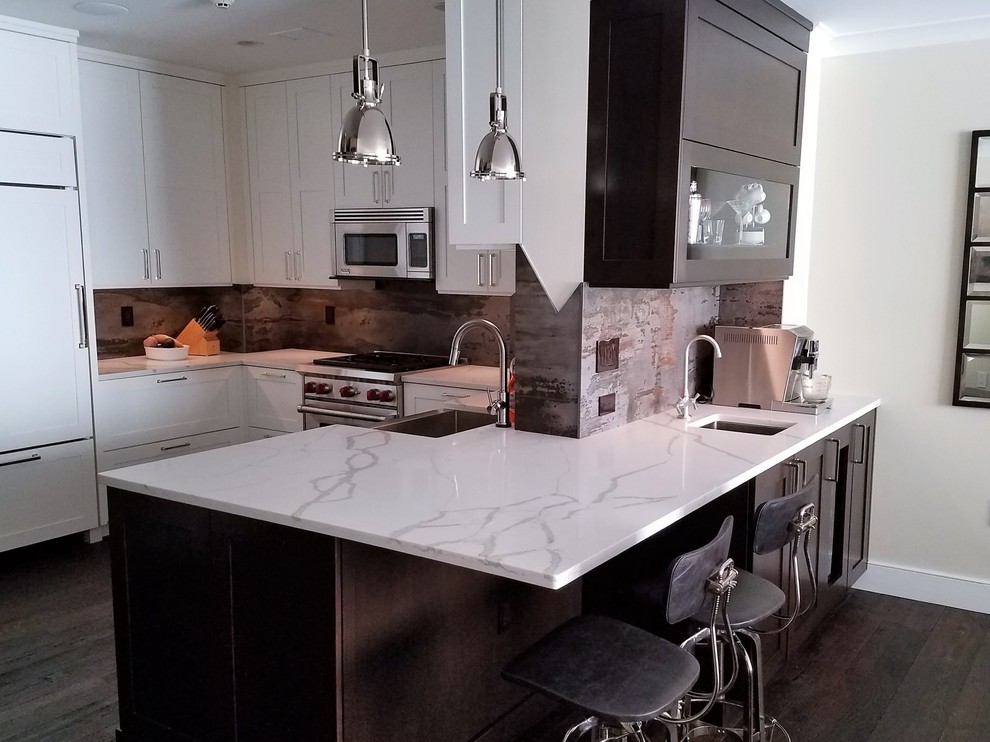 Mid-sized u-shaped dark wood floor kitchen photo in New York with shaker cabinets, quartz countertops and multicolored backsplash
