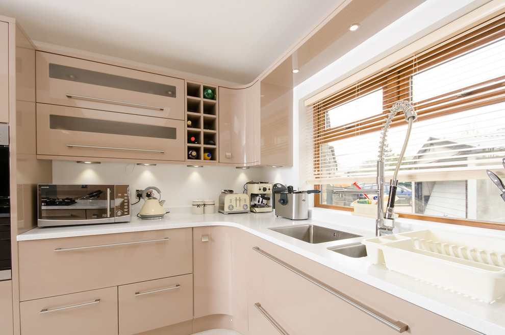 Make a spacious modern kitchen feel warm and inviting with pale coffee